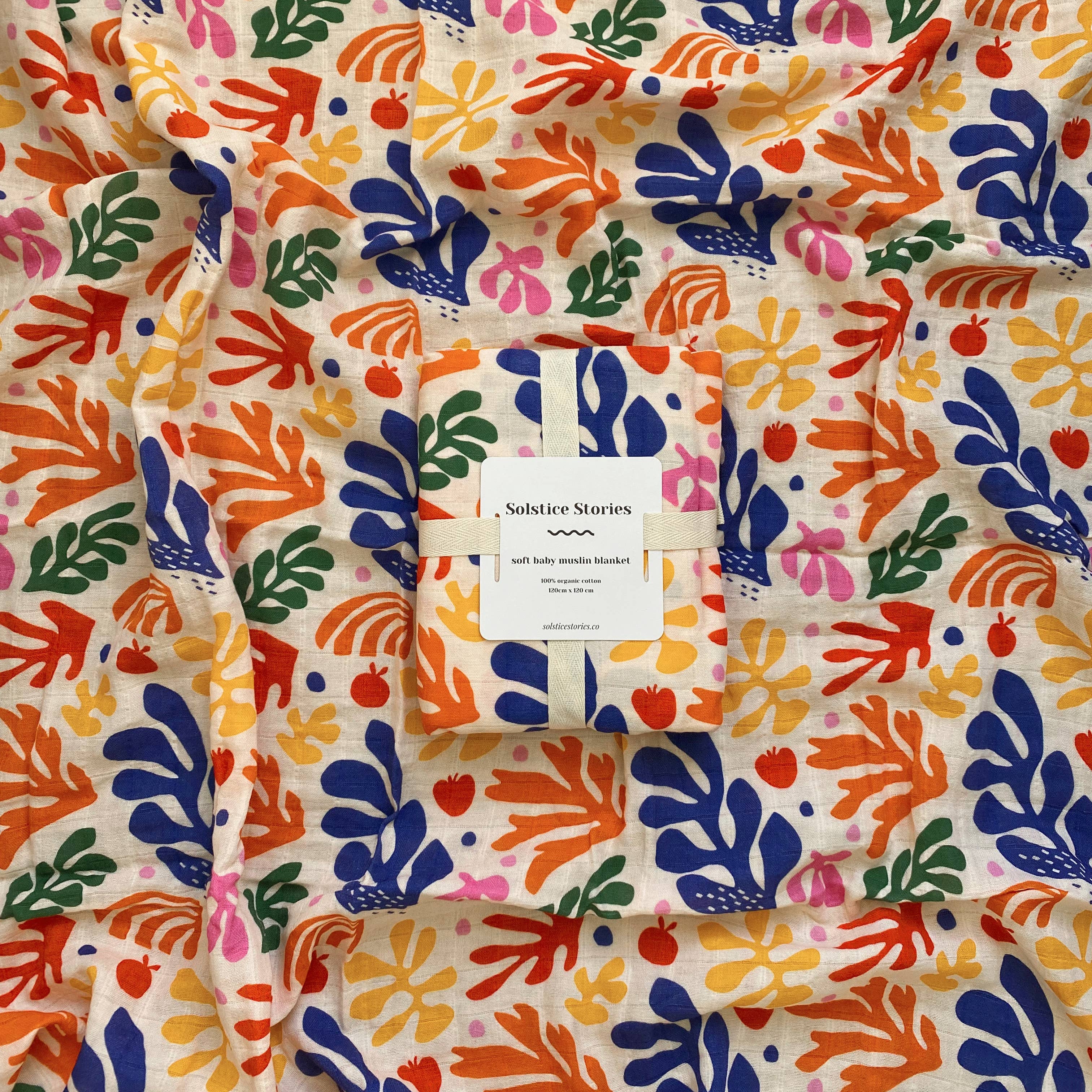 Organic cotton muslin swaddle with colourful floral pattern